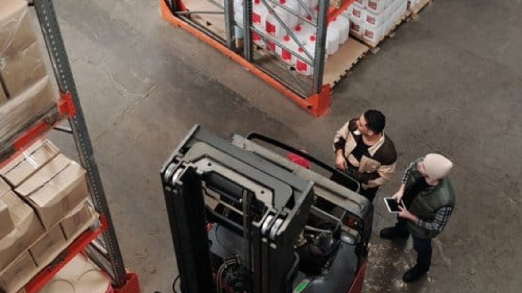 warehouse-workers-looking-at-shelves