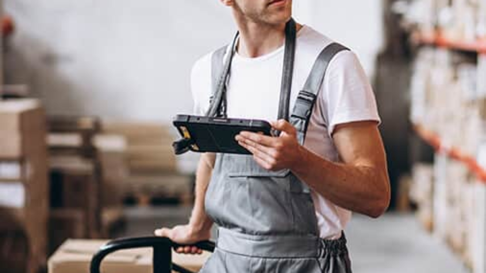 warehouse worker taking inventory in a warehouse
