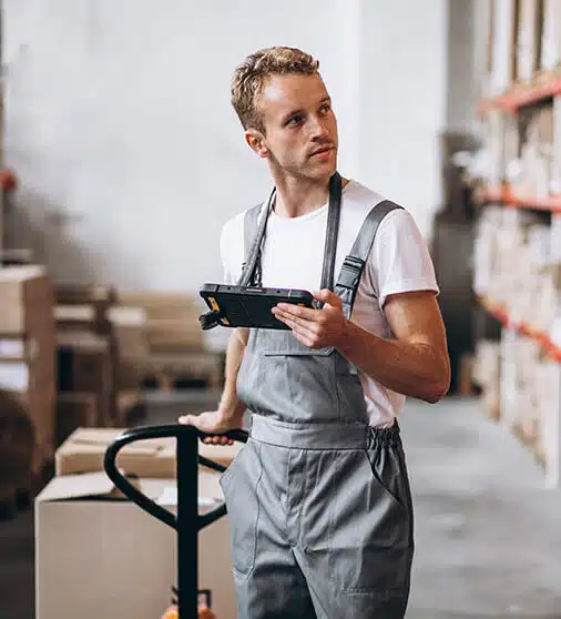warehouse worker taking inventory in a warehouse