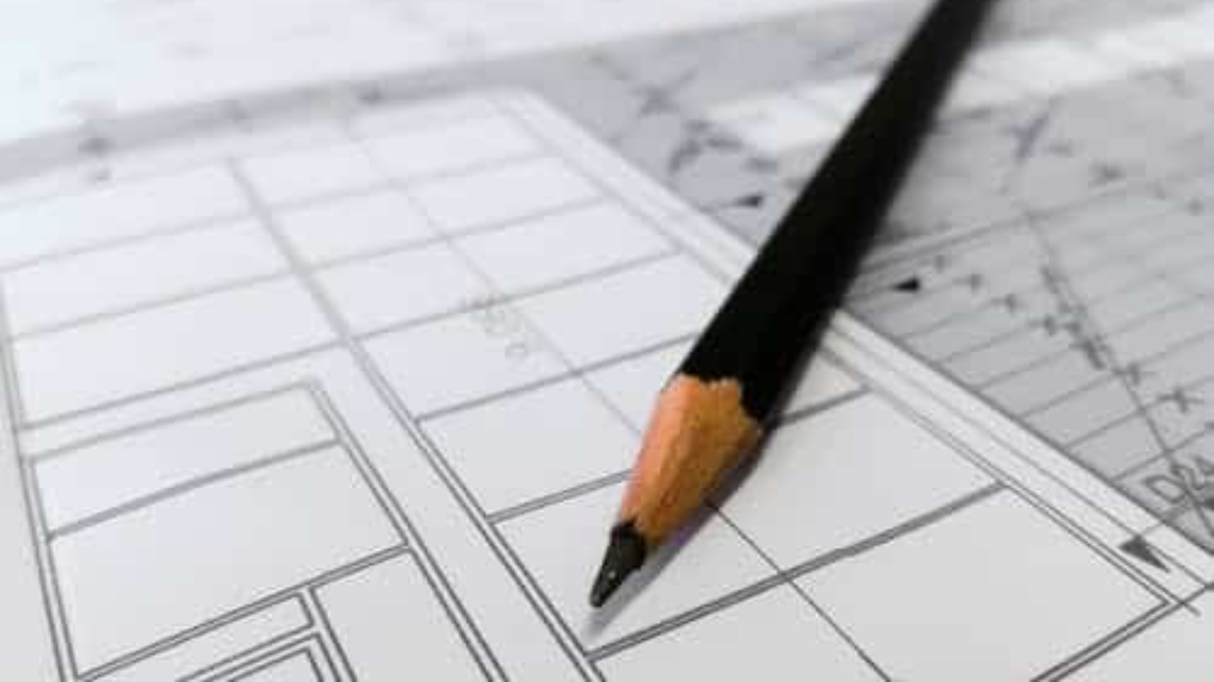 pencil-resting-on-blueprints
