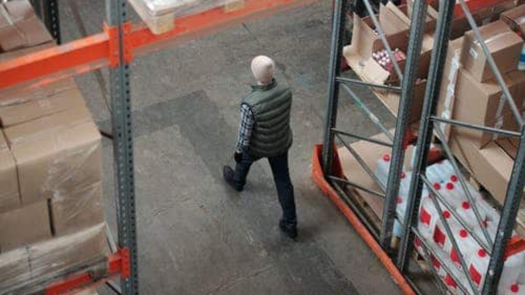 man walking through warehouse