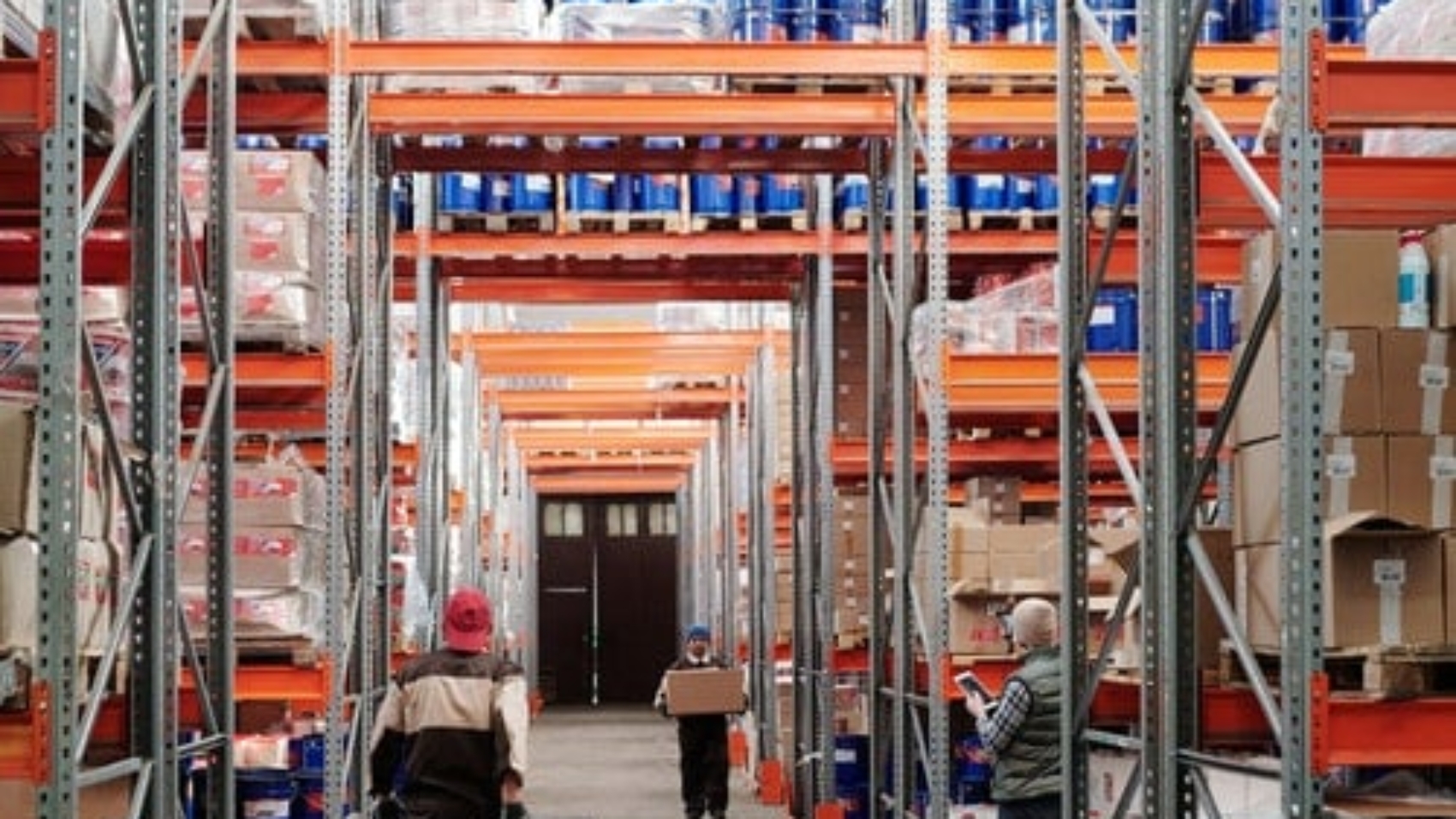 warehouse workers standing far apart