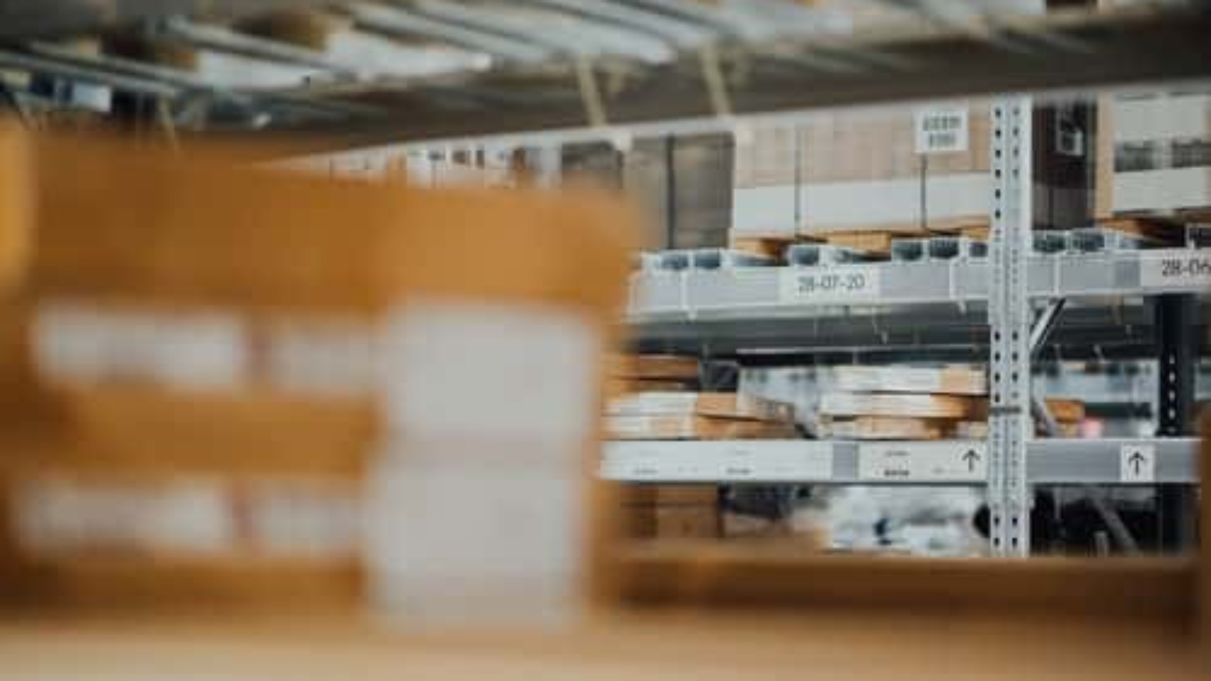 boxes stacked on metal racks