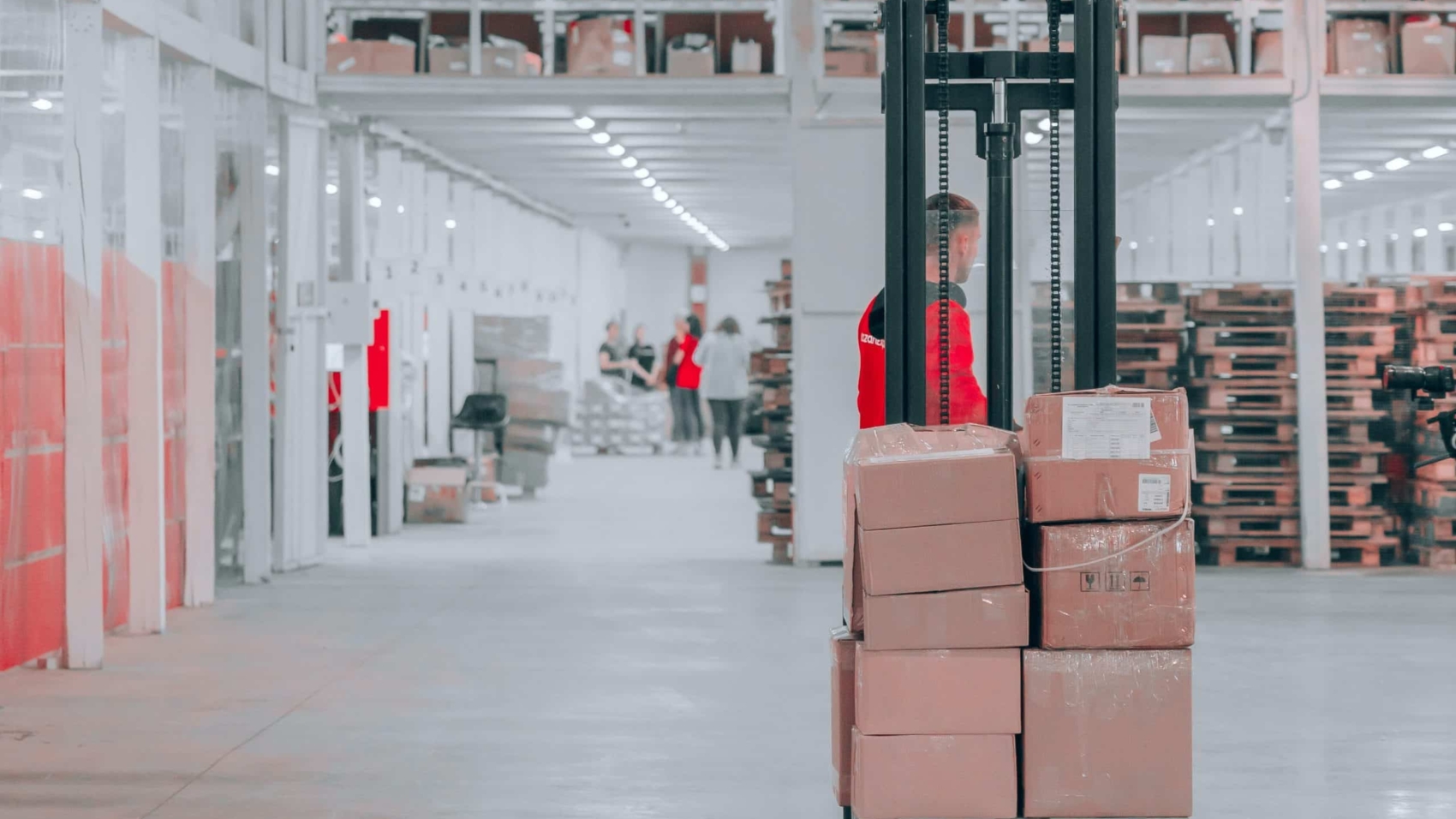 warehouse worker operating pallet jack