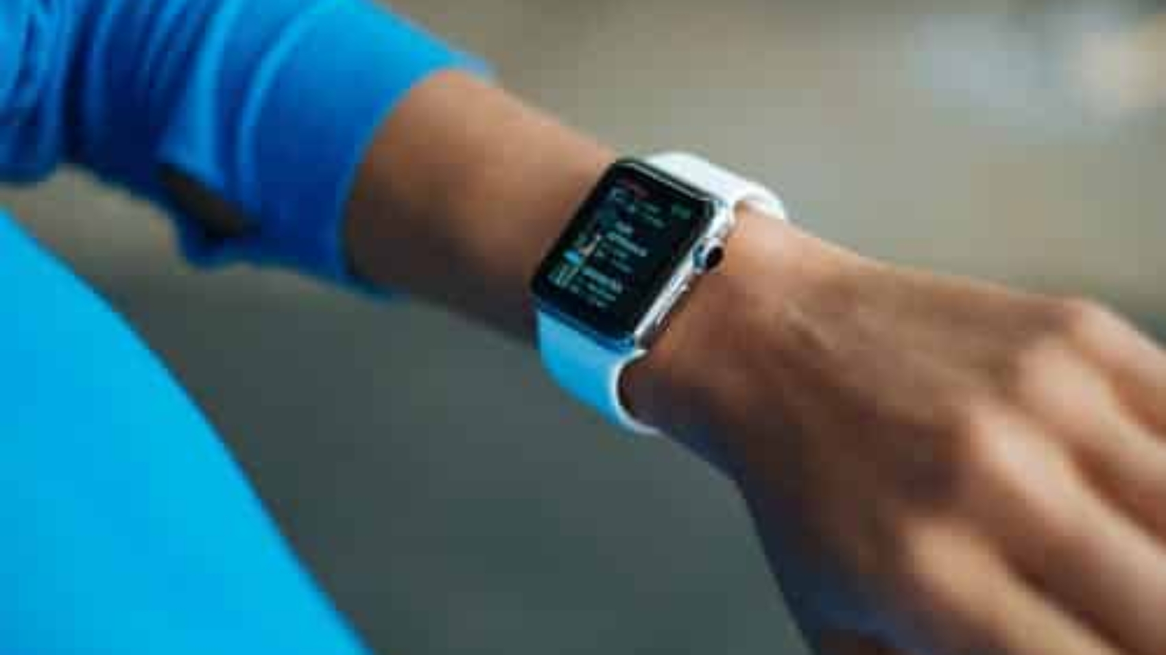person looking at watch on their left wrist
