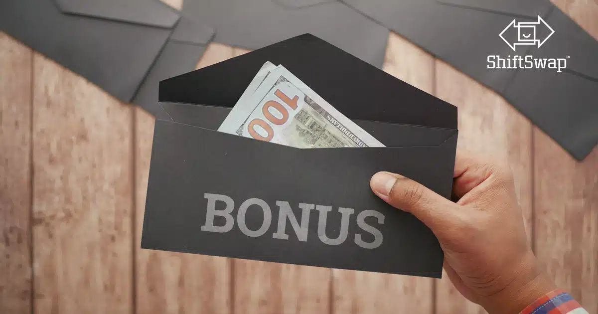 Image showing money in an envelope with "Bonus" written. Focused on the short term benefit not the long term impact of signing bonuses.