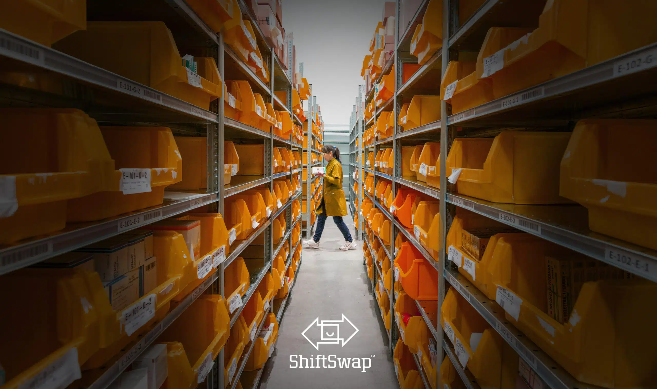 warehouse working walking past an aisle