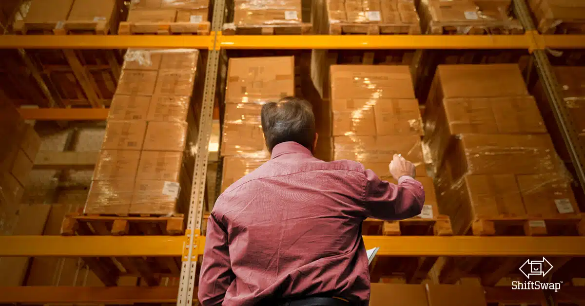 warehouse worker pointing at inventory