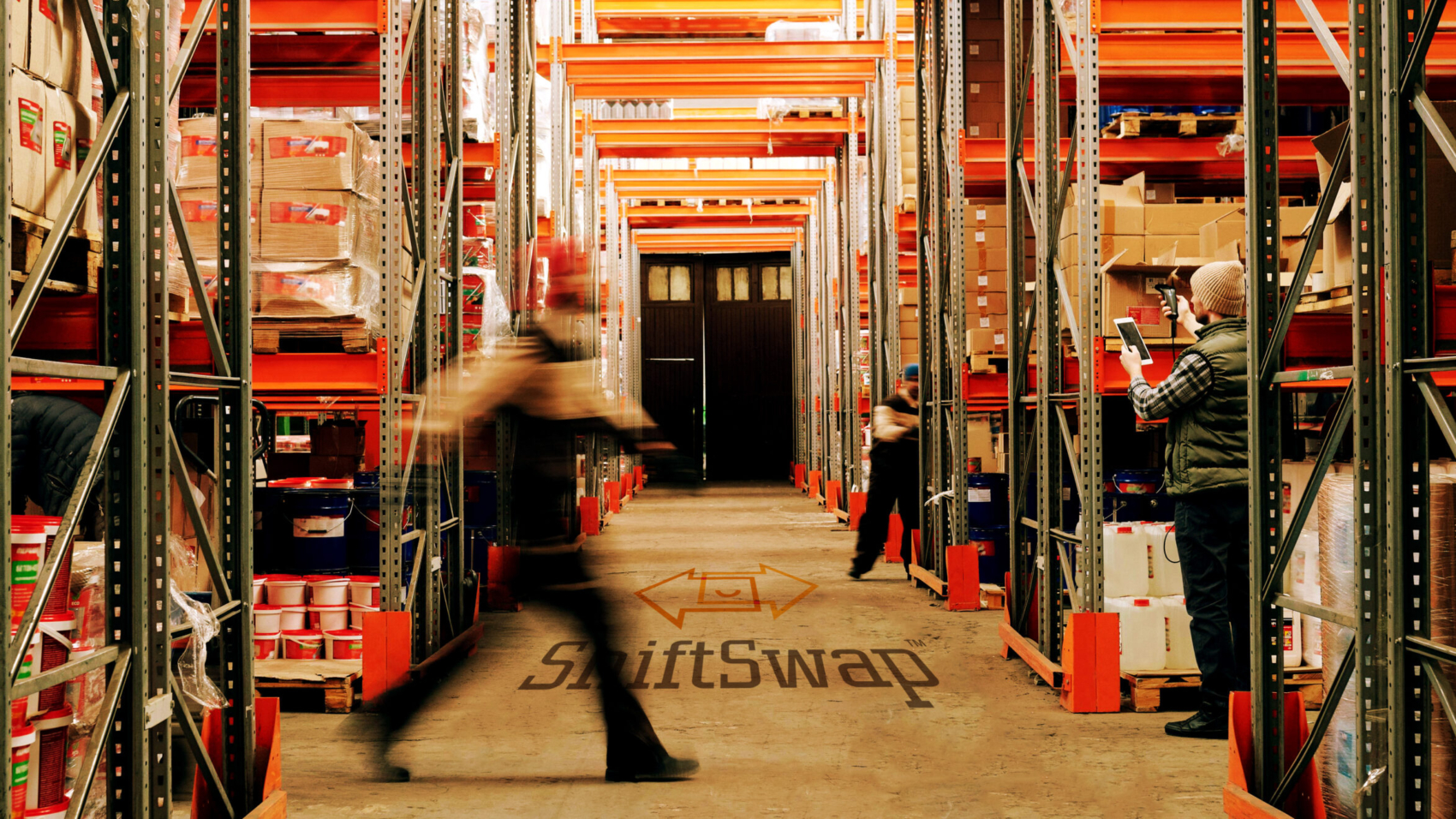 motion blur of a man walking in a warehouse