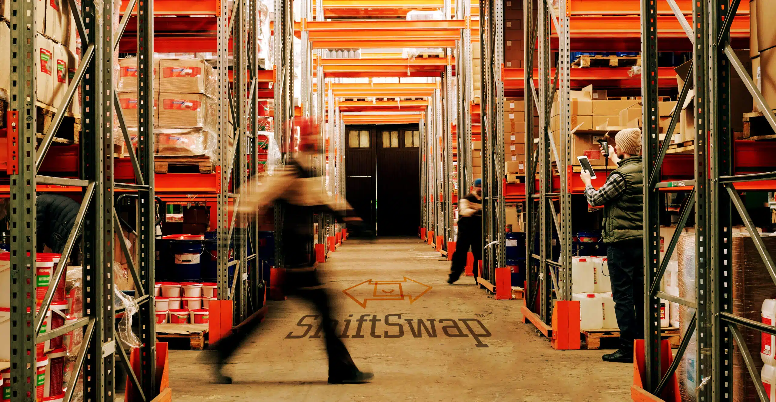 motion blur of a man walking in a warehouse
