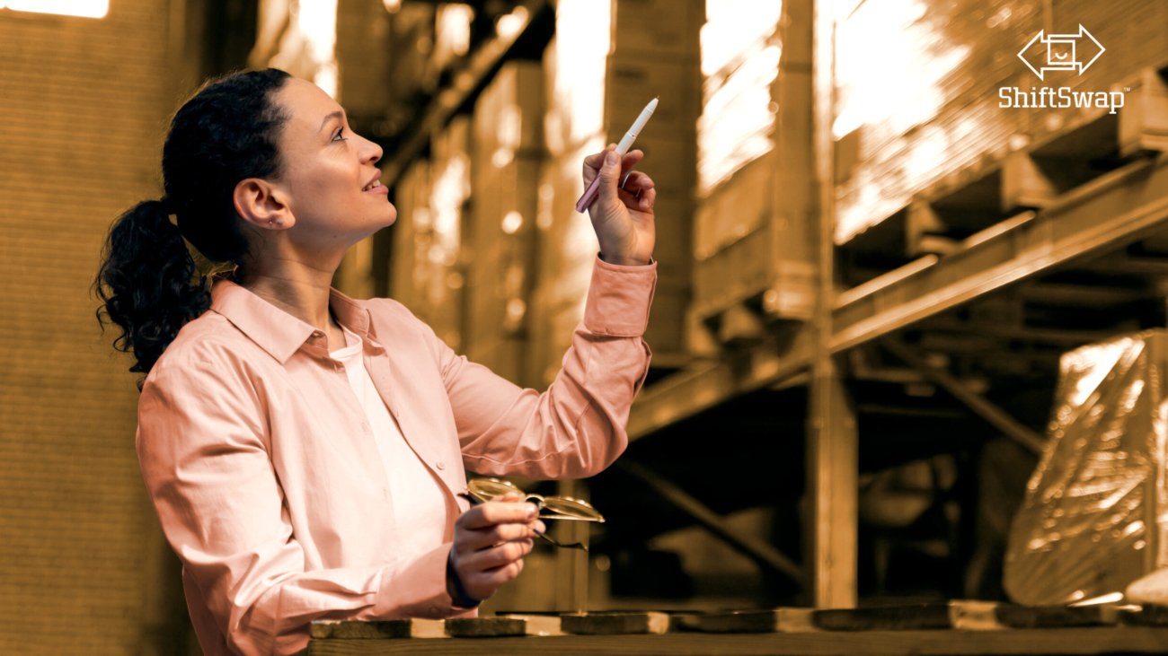 woman pointing at warehouse inventory