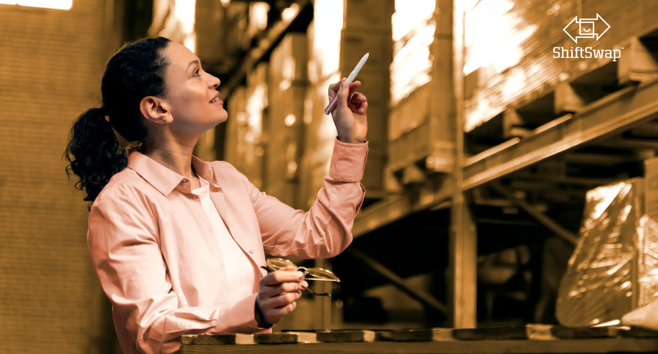 woman pointing at warehouse inventory