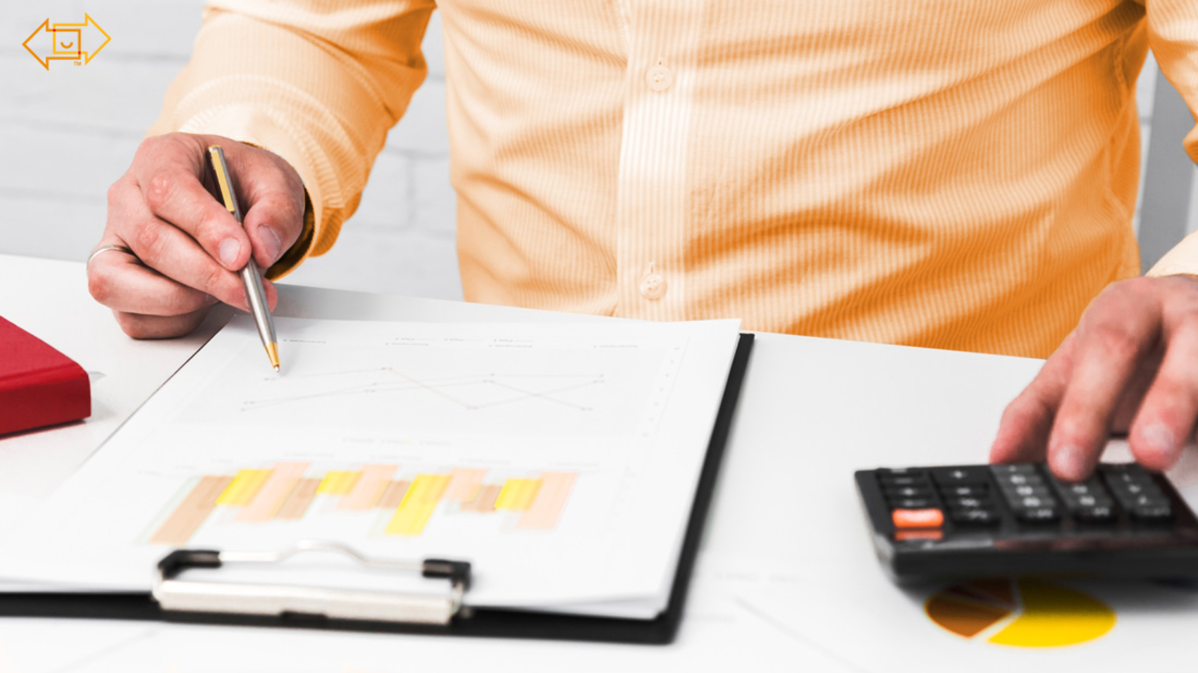 male close up with graph and calculator on desk