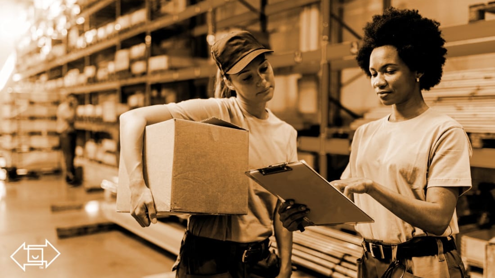 two female frontline workers in a warehouse