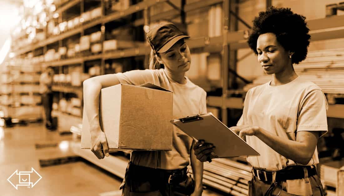 two female frontline workers in a warehouse