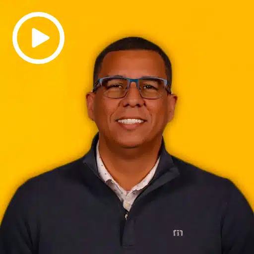 warehouse worker with a play button in the top left corner