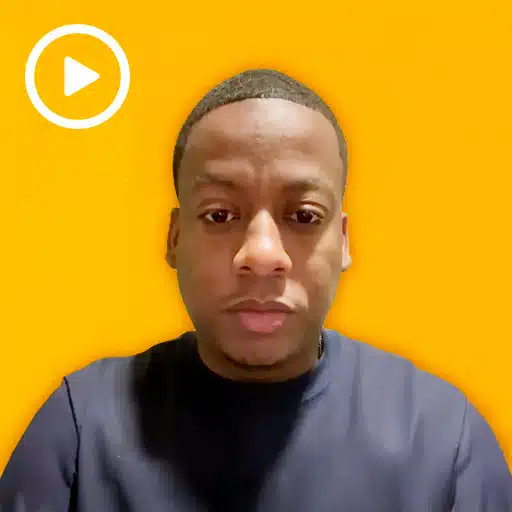 warehouse worker with a play button in the top left corner