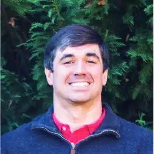 male smiling portrait with nature background