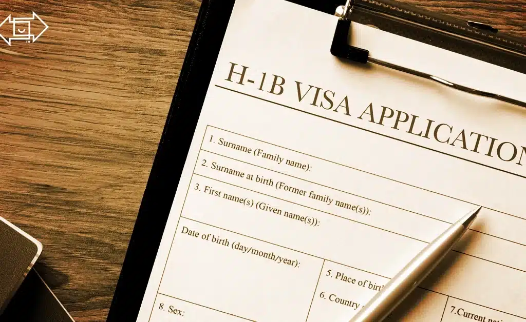 h-1b visa fee application form on clipboard