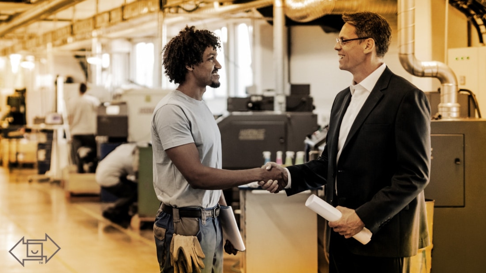 male coworker shaking hands with male supervisor