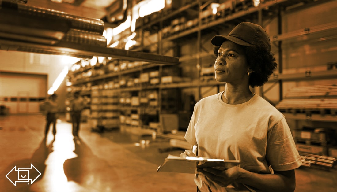 female warehouse worker with a clipboard