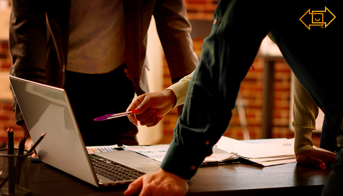 employees invested in the workforce looking at a computer screen