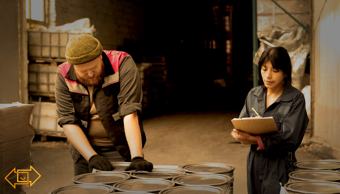 2 warehouse workers in the warehouse making notes of operational improvements in logistics