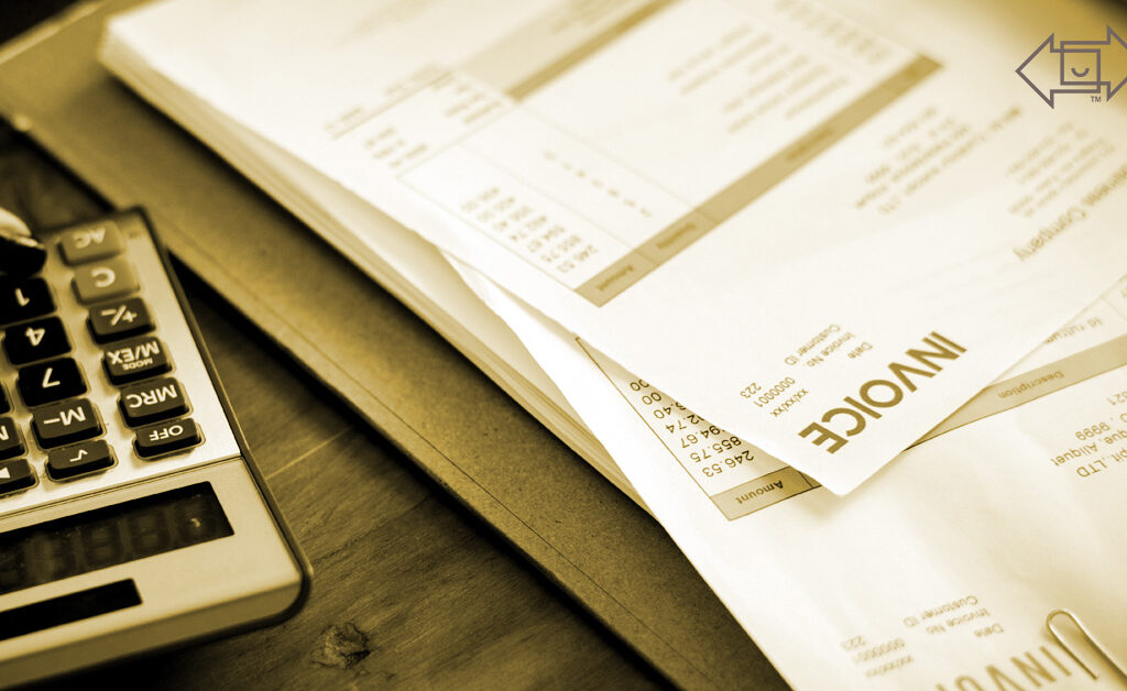 invoices and calculator on a desk showing global tariff differences