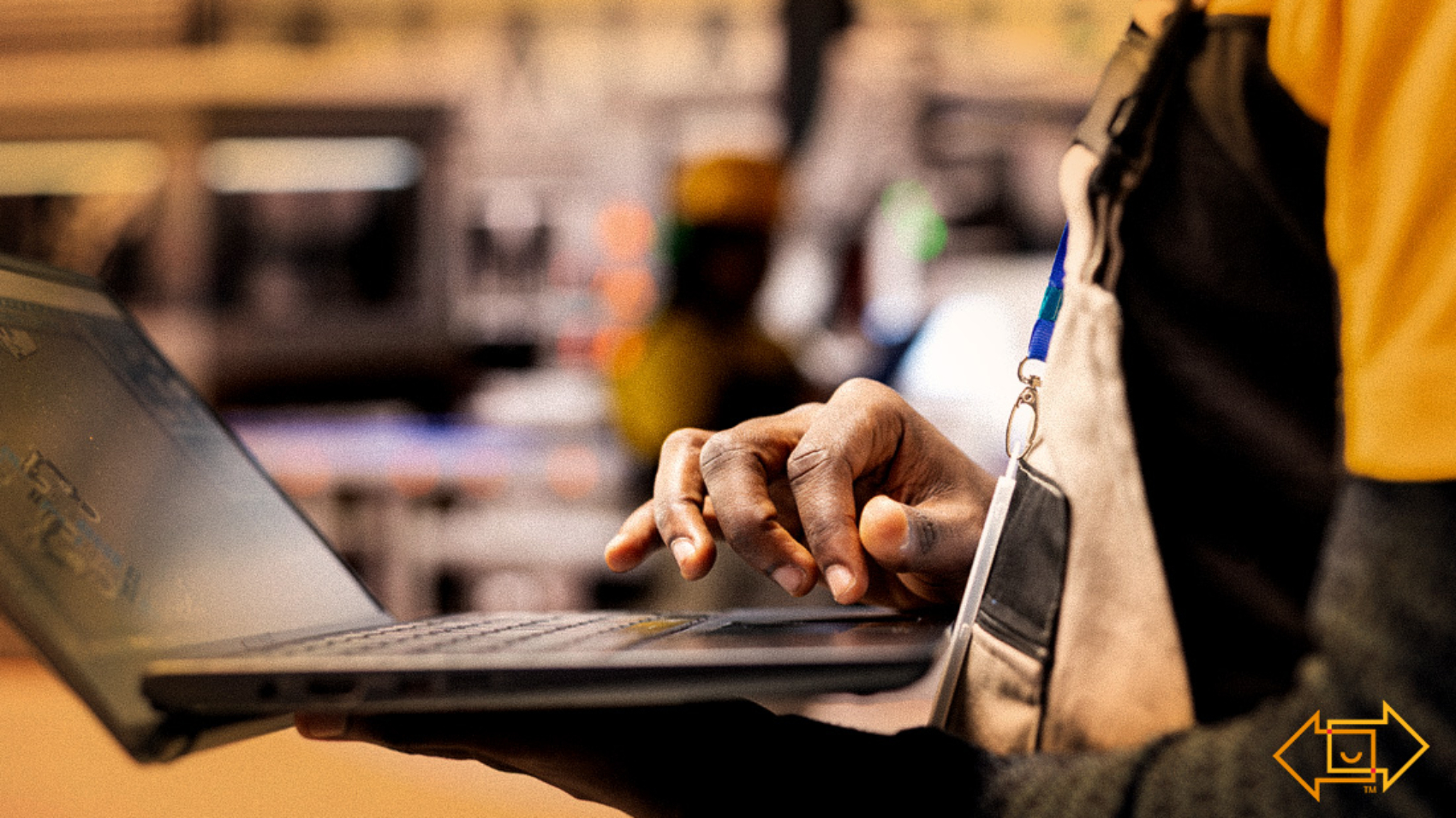 warehouse worker on laptop checking with ai workforce strategy in machinery